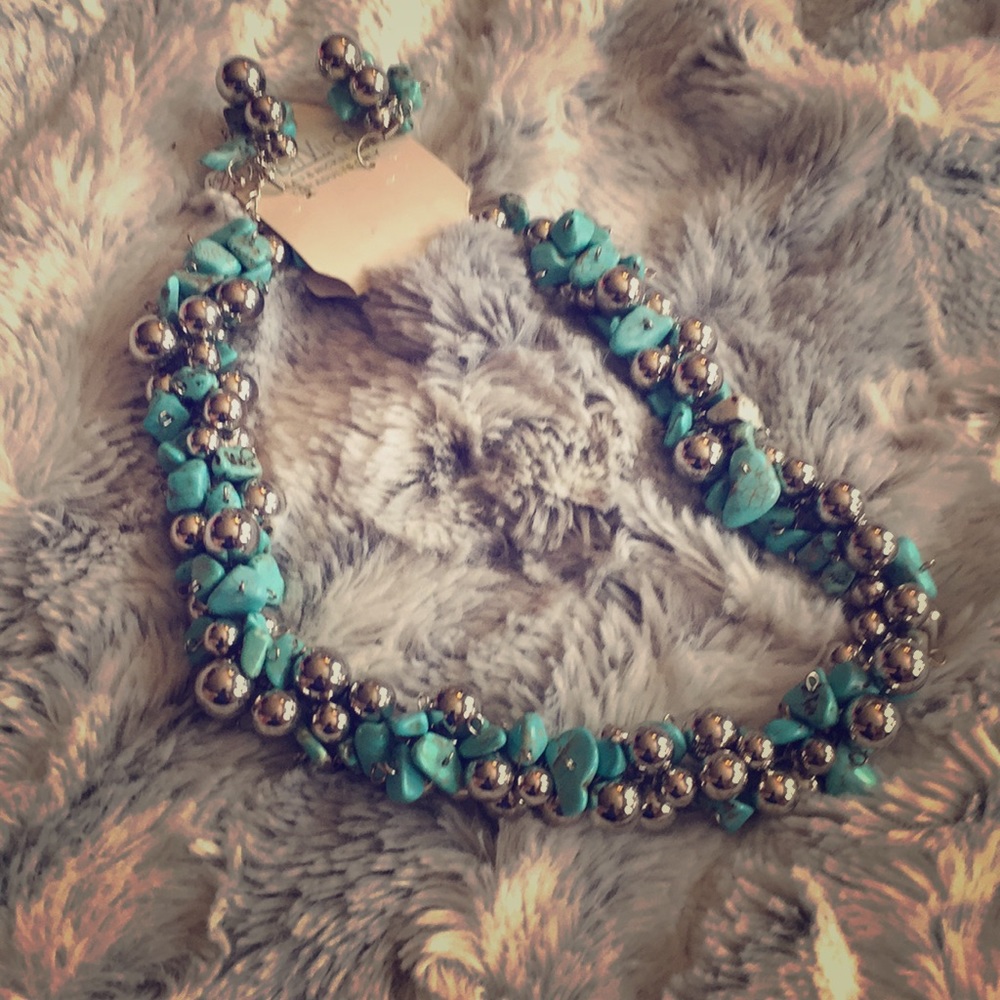 A womens chircouse and silver necklace